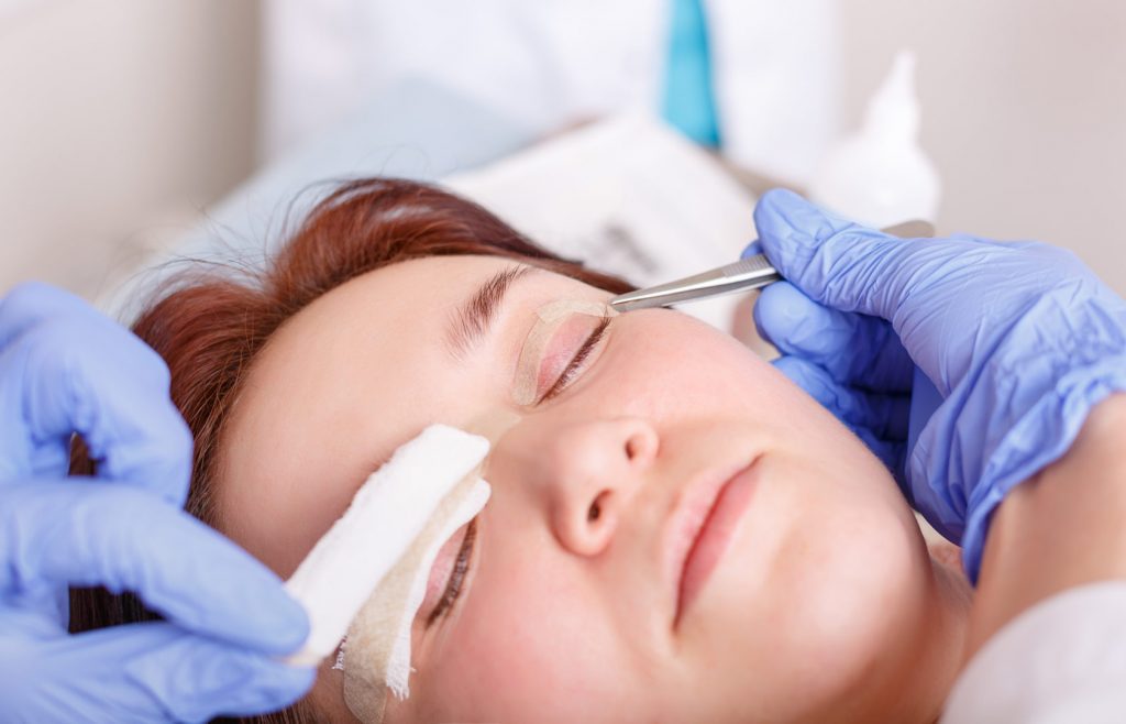image of patient while doctor is removing gauze after procedure